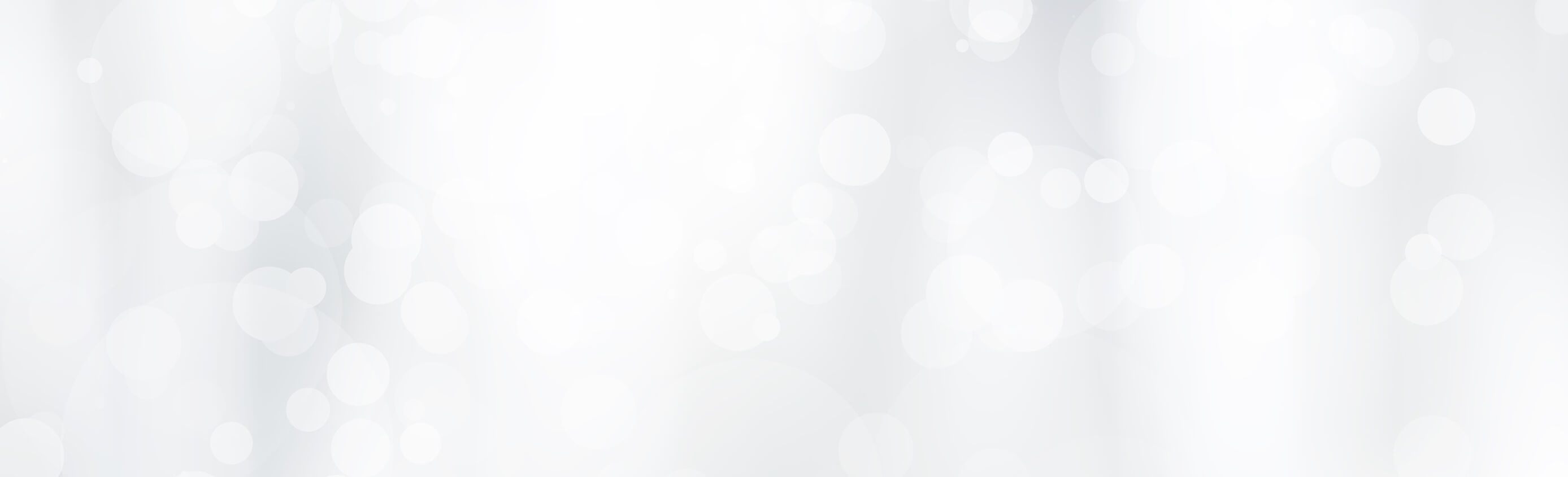 Soft white and light gray abstract bokeh background with blurred circular light spots